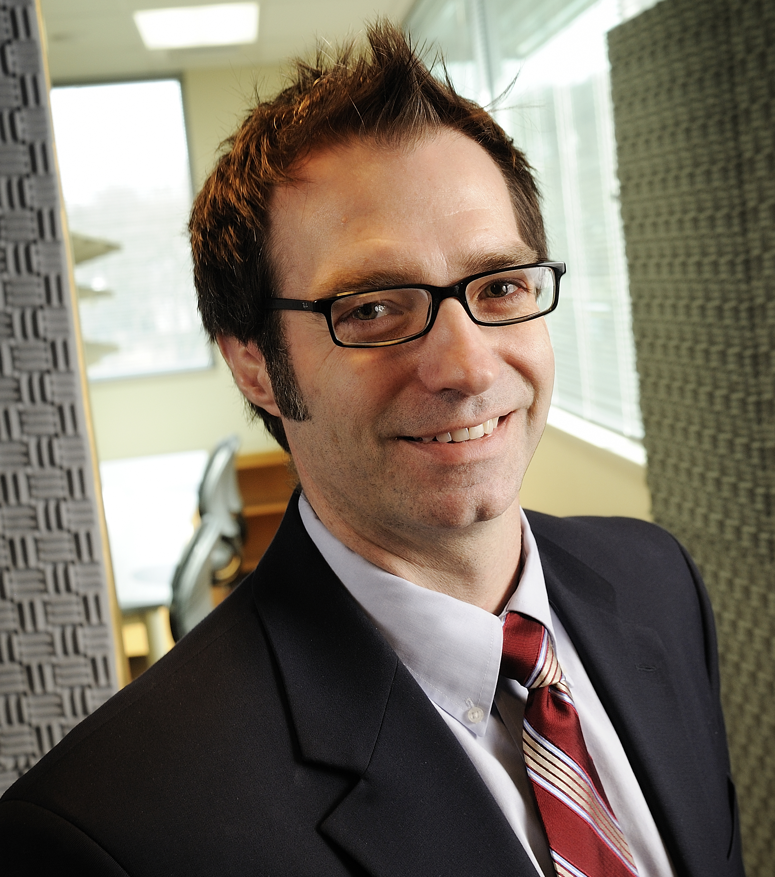 man in suit in padded room