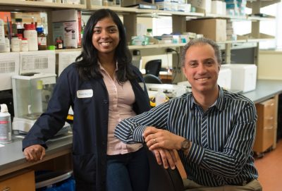 Sharon George stands with her mentor, Steven Poelzing. They discovered the ratio of minerals in a saline solution could drastically affect function in cardiac cells. 