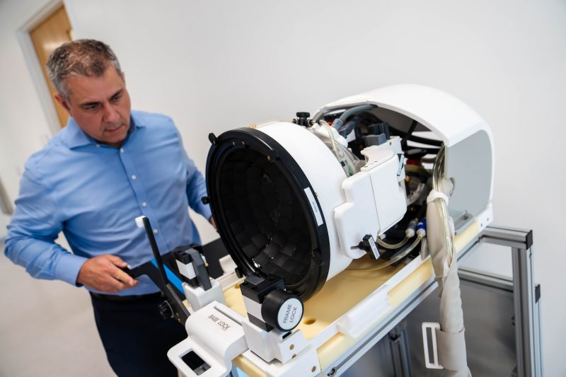 Jason Raymond with focused ultrasound machine