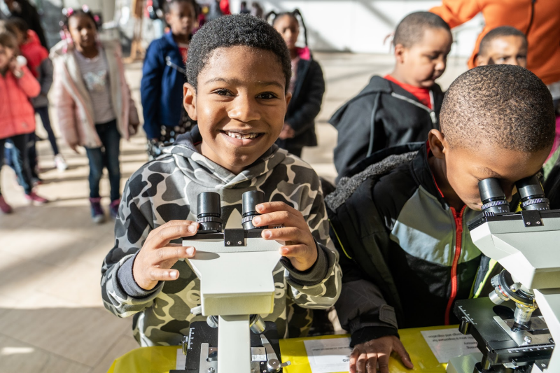 Boys with microscopes at STEAM Day
