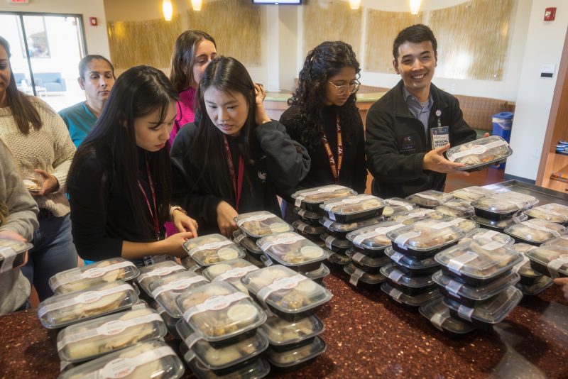 Students picking up meals
