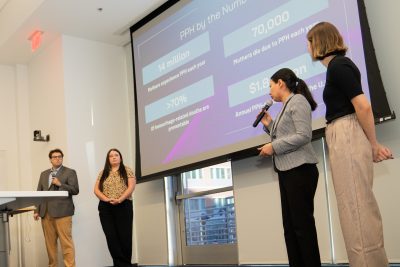 Luna Care, whose name is a celestial reference to charting new frontiers in women’s health, was one of five student teams competing Walter Dickey (at left), Kari Kochran, Nasrin Elahimehr, and Macy Parmelee present on postpartum hemorrhage.